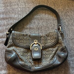 This is a vintage Coach F10926 Soho Signature Flap shoulder bag